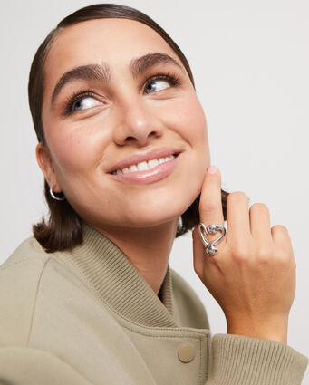 Silver-plated open ring with a nailed heart design